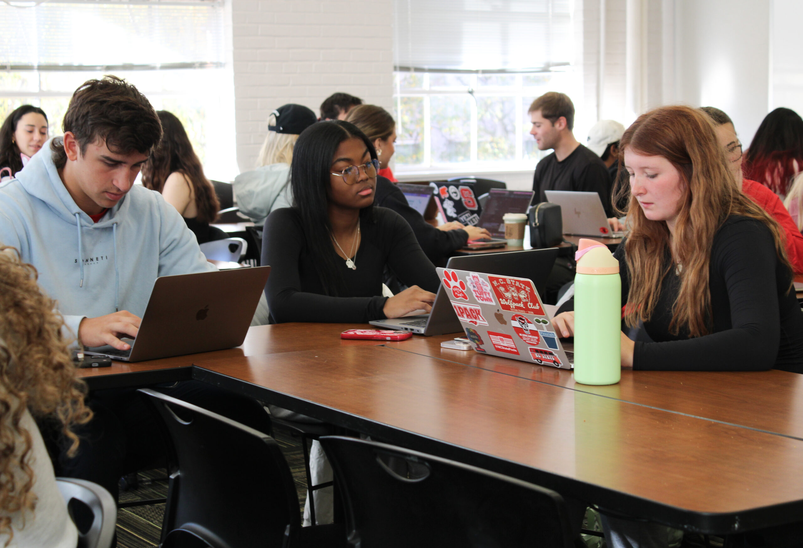students using laptop in classroom