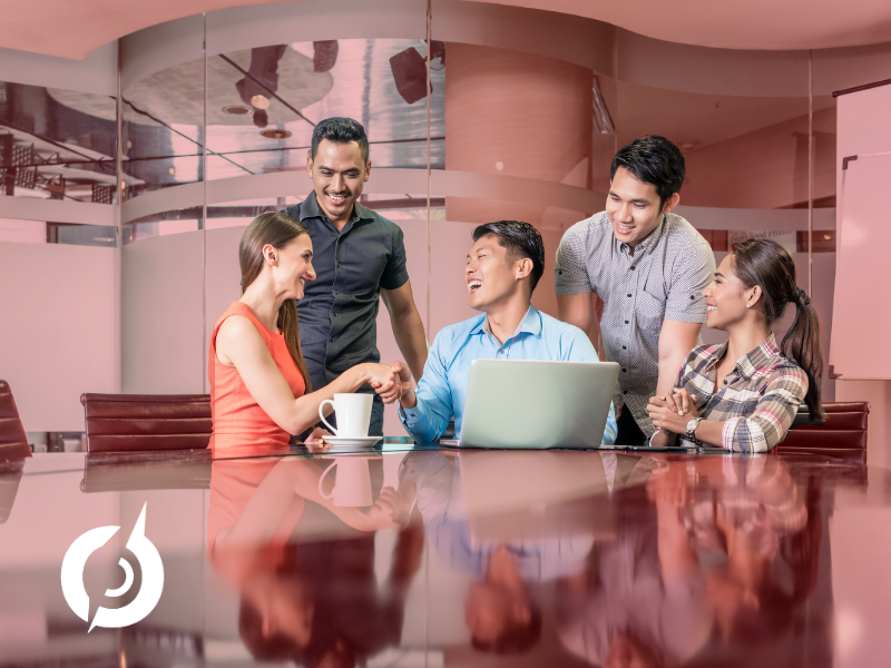 people gathered around a computer