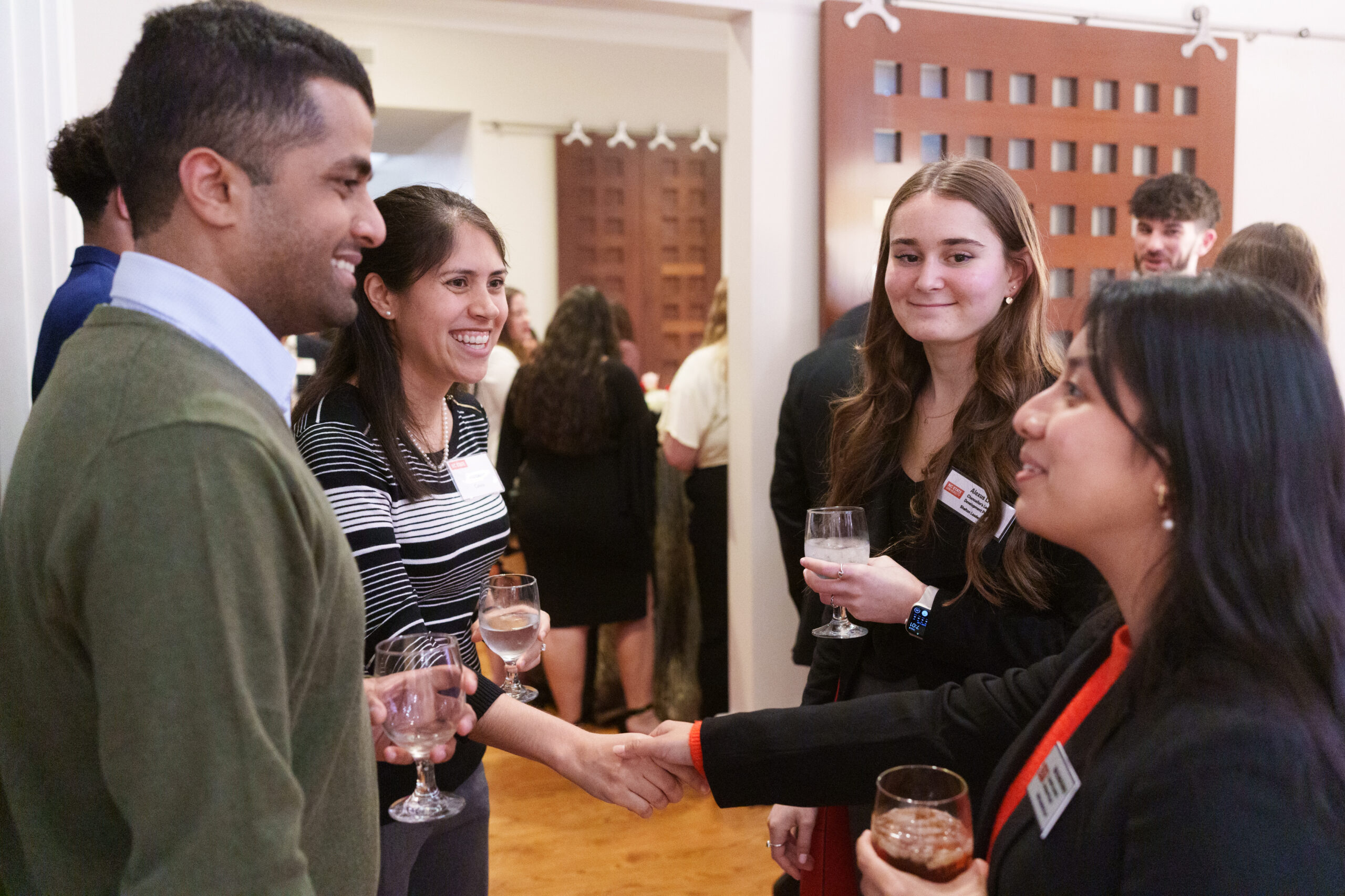 Students and mentors networking at shelton event.